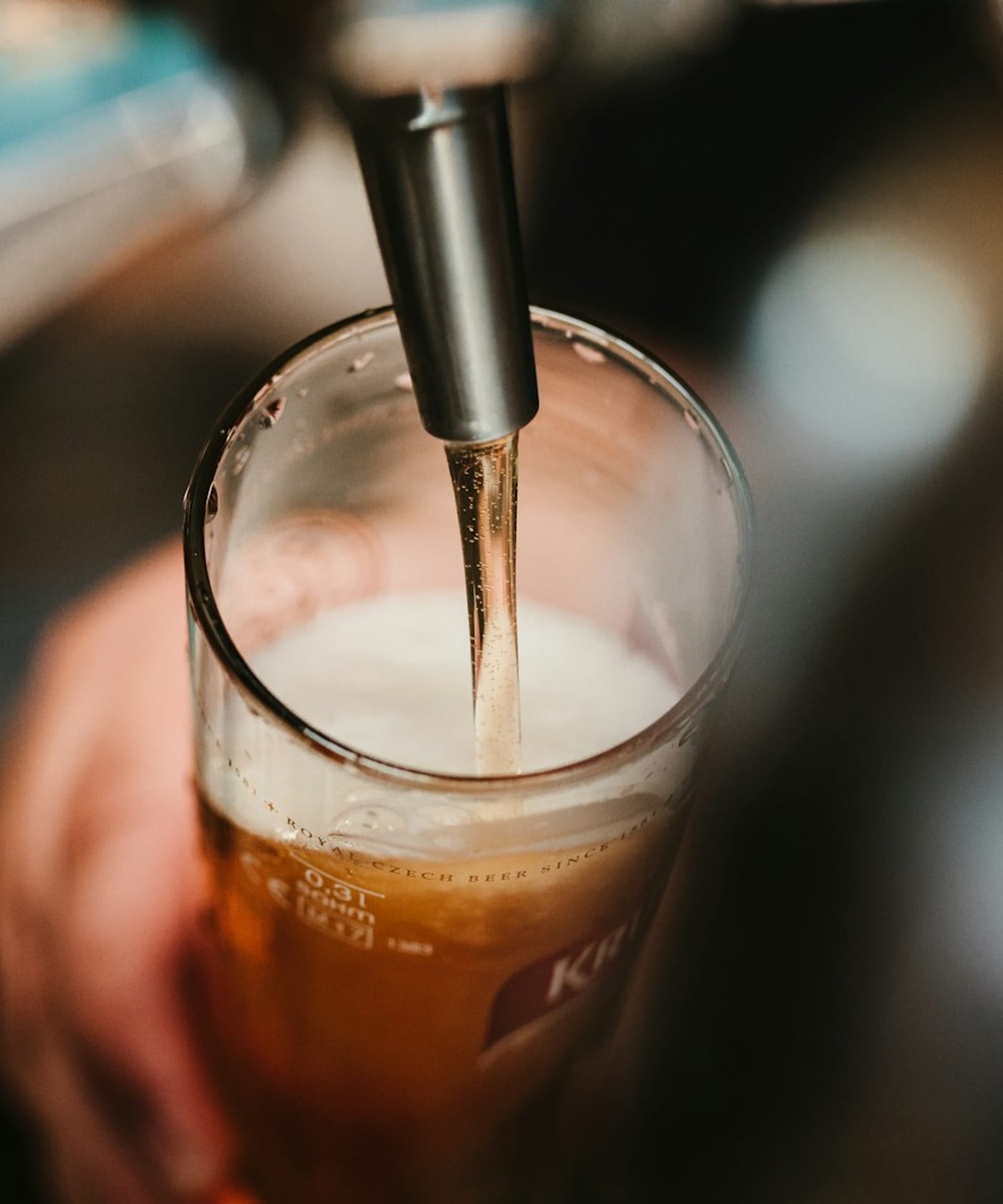 Craft brewery taps with golden beer pouring